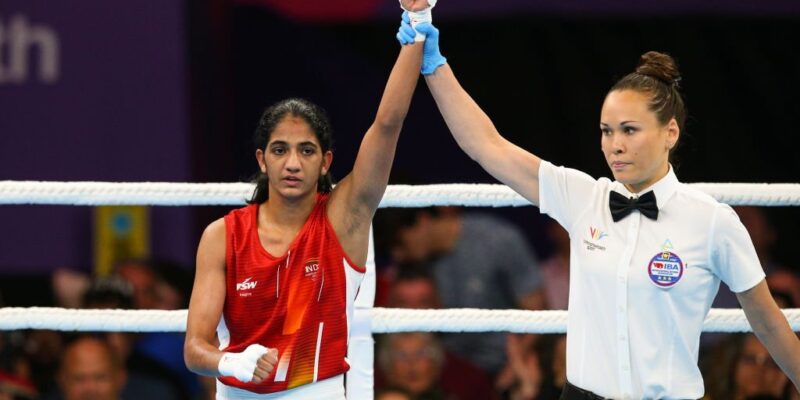Nitu (red) of Team India celebrates victory against Nicole Clyde