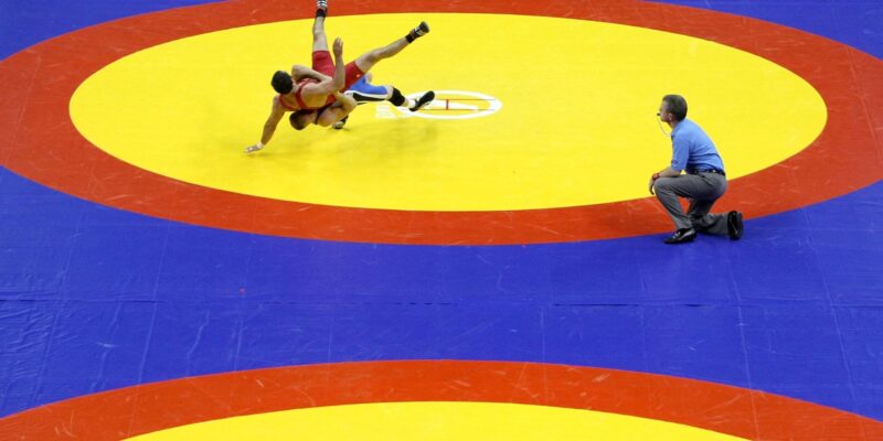 Wrestling bouts halted after speaker falls from ceiling