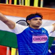 Neeraj Chopra with the Indian flag