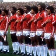 players standing in team for the national anthem before the match