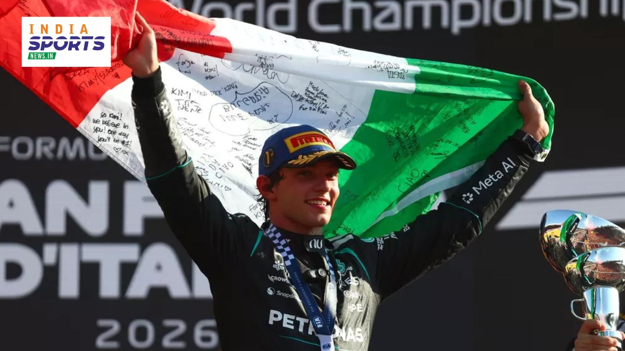 Kimi Antonelli celebrates a podium finish for Mercedes after a remarkable P19-to-P1 recovery, holding the trophy in his F1 race suit.