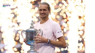 Alexander Zverev holds the 2026 US Open trophy after winning the men’s singles final.