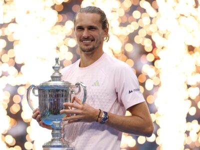 Alexander Zverev holds the 2026 US Open trophy after winning the men’s singles final.
