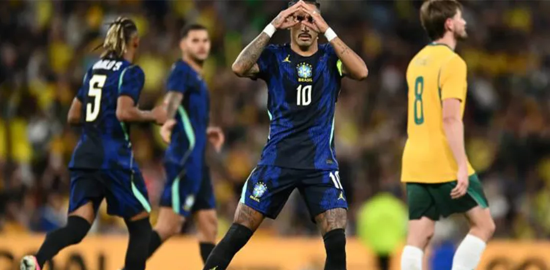 Raphinha celebrating after scoring a goal against Australia.